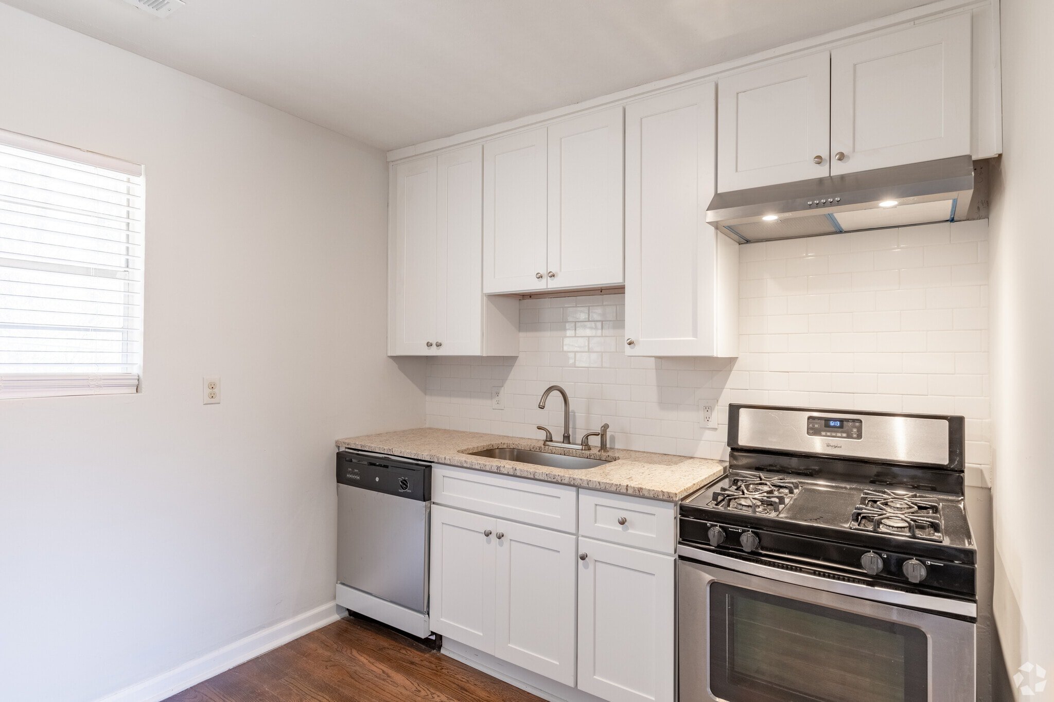 kitchen with granite tops and subway tiles